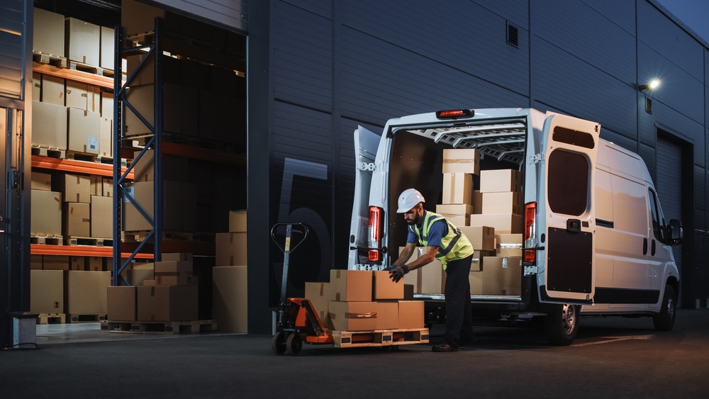 Outside,Of,Logistics,Distributions,Warehouse,Delivery,Van:,Worker,Unloading,Cardboard